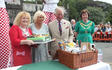 Prince Charles being presented with a hamper of local produce